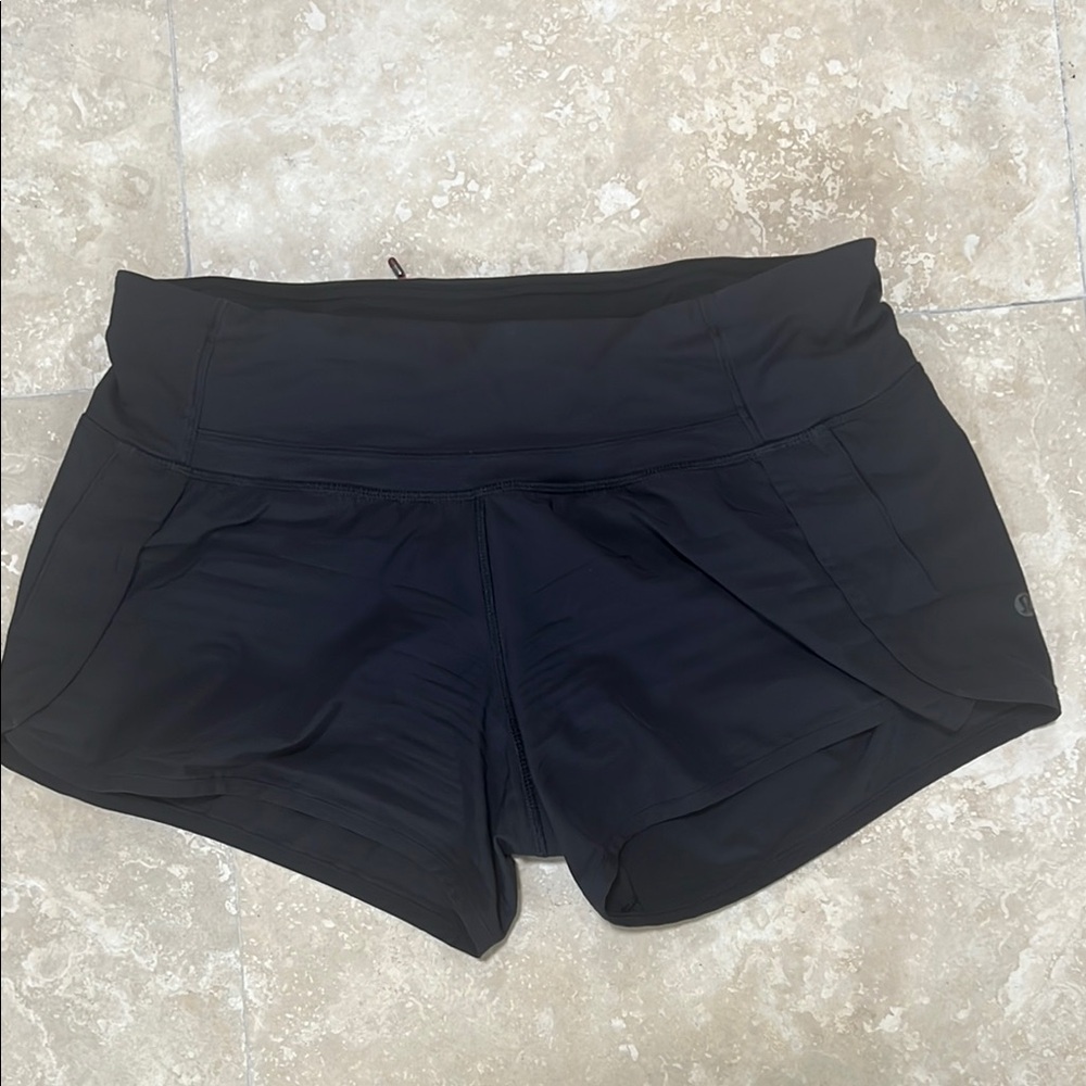 Lululemon Black Athletic Shorts with Elastic Waistband and Tapered Design